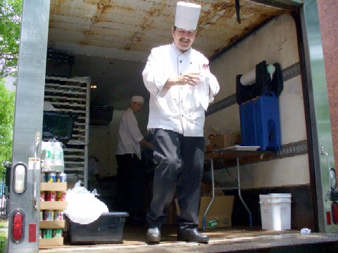 HUDS chef with hat and worker behind him.