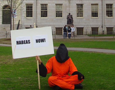 A member of the Harvard Anti-Torture Coalition demands 