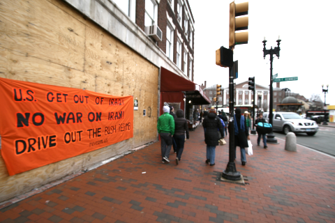 Revolutionary Communist Party banner on boarded up storefront in Harvard Square.