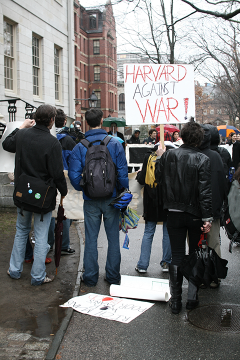 Harvard gathers against the War at the Statue of the Three Lies.