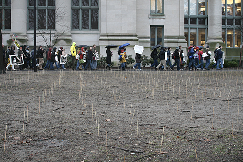 Harvard Anti War Coalition marches past skewers planted in the Law School Yard to commemorate iraqi and American dead.