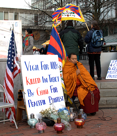 Tibetan Monk in the Harvard Square Pit chanting om mani padme hum - a mantra for compassion.