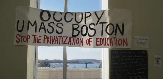 Sign and view of the harbor from level 1 of the Campus Center at UMASS Boston 1/28/12