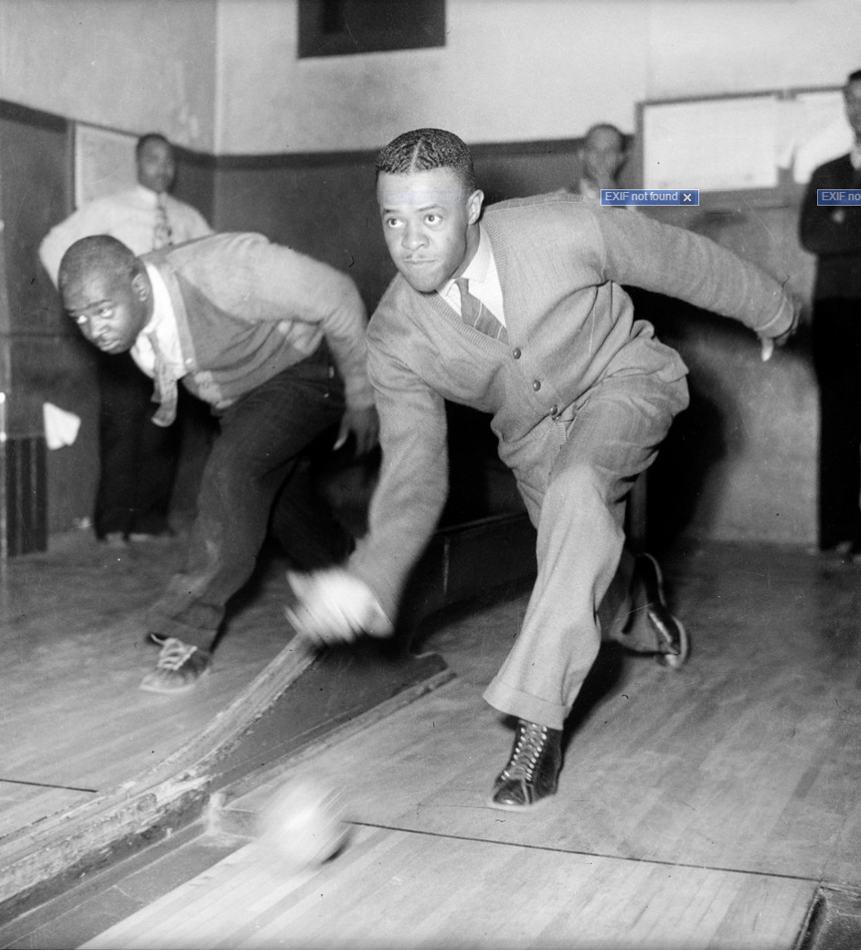 Two men duckpin bowling, possibly in Hillvue Bowling Alley, 2424 Wylie Avenue, Hill District. Accession No.: 2001.35.33280